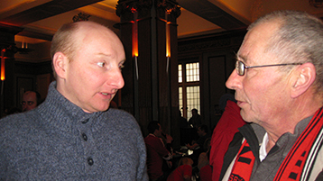 Mariners fanatic John, representing the Imperial Club, discusses absent friends with the Chairman.