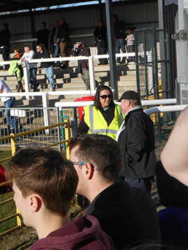 Sergant Dodds in discussion with a match steward about battle plans and exit manoeuvres at the end of the game.