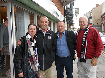 Fully on board the Histon Mariners leadership is welcomed by Stuart Bateman, confidant Tina, his favourite female clothes shop, owner of 