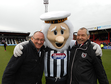 Andy Carr aka Mighty Mariner greets the Dean and the Chairman.